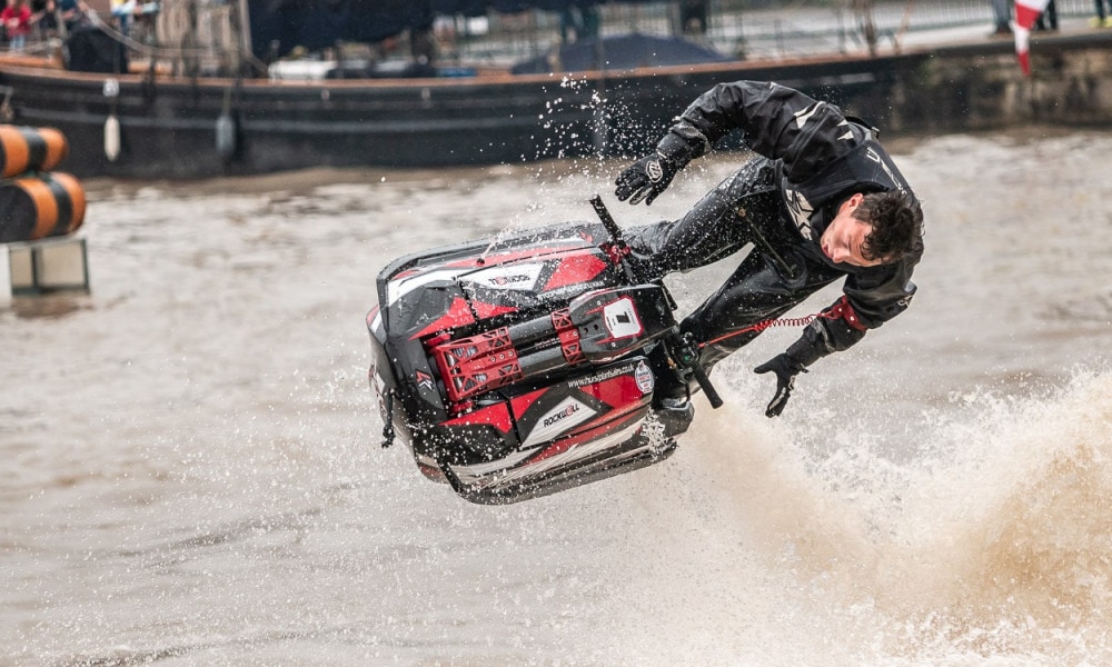 Jet-ski ride performs exhilarating jump.