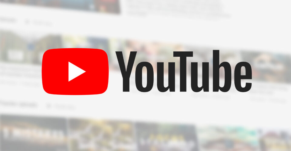 YouTube logo on a blurred background of a YouTube channel page.