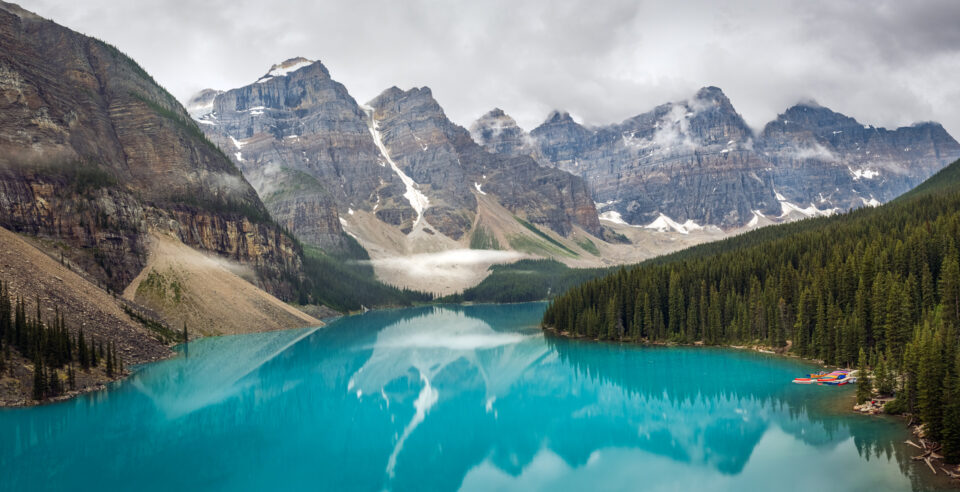 Moraine Lake with turquoise waters and surrounding mountain peaks in Banff National Park.