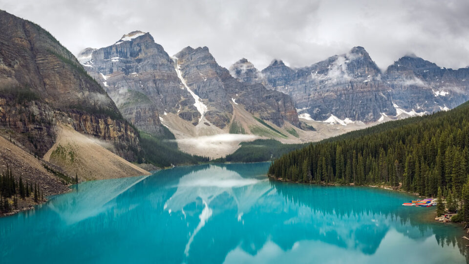 Moraine Lake with turquoise waters and surrounding mountain peaks in Banff National Park.